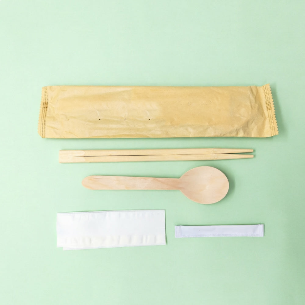 Paper sleeve, twin chopsticks, wooden spoon, napkin, toothpick
