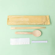 Paper sleeve, twin chopsticks, wooden spoon, napkin, toothpick