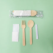 Plastic sleeve, wooden spoon, fork, napkin, toothpick